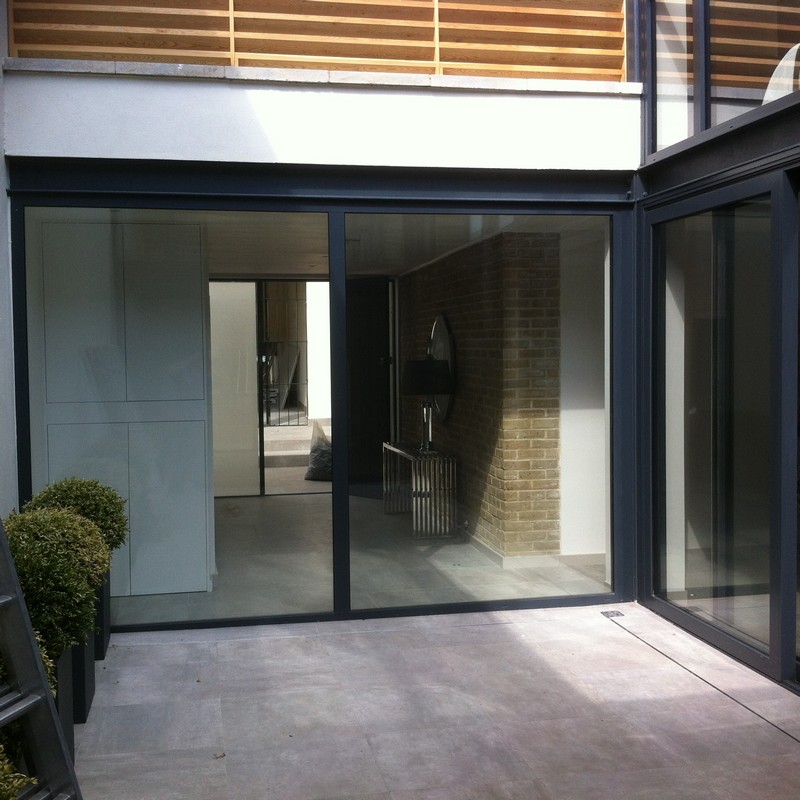 Floor-to-ceiling sliding doors opening to courtyard in Camberwell