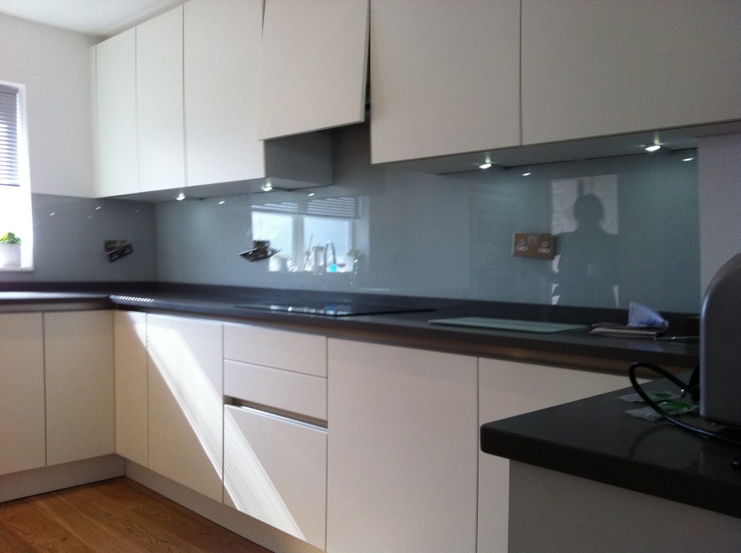 Grey glass kitchen splashback with LED lighting in Camberwell