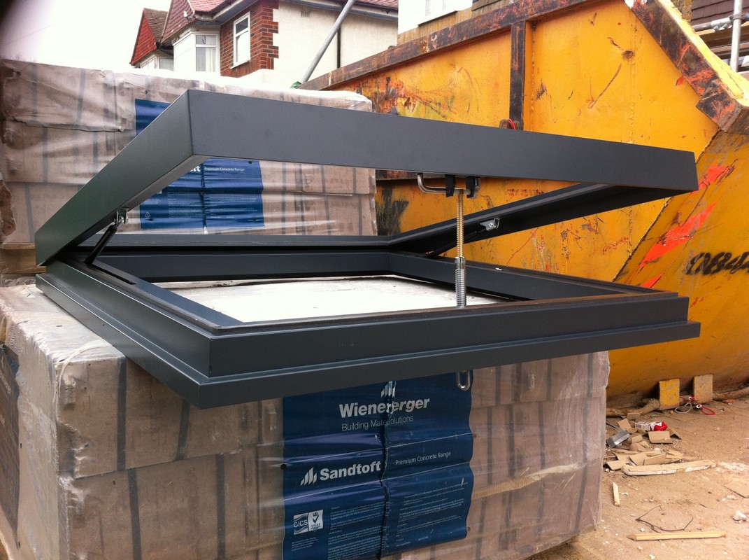 Opening flat roof skylight in anthracite grey installed in Camberwell