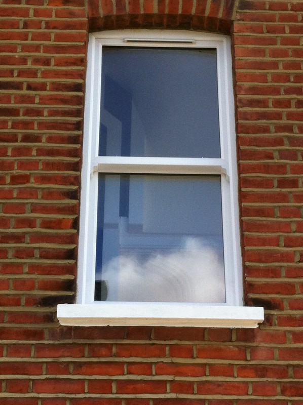 uPVC sash window on Victorian red brick house in Camberwell